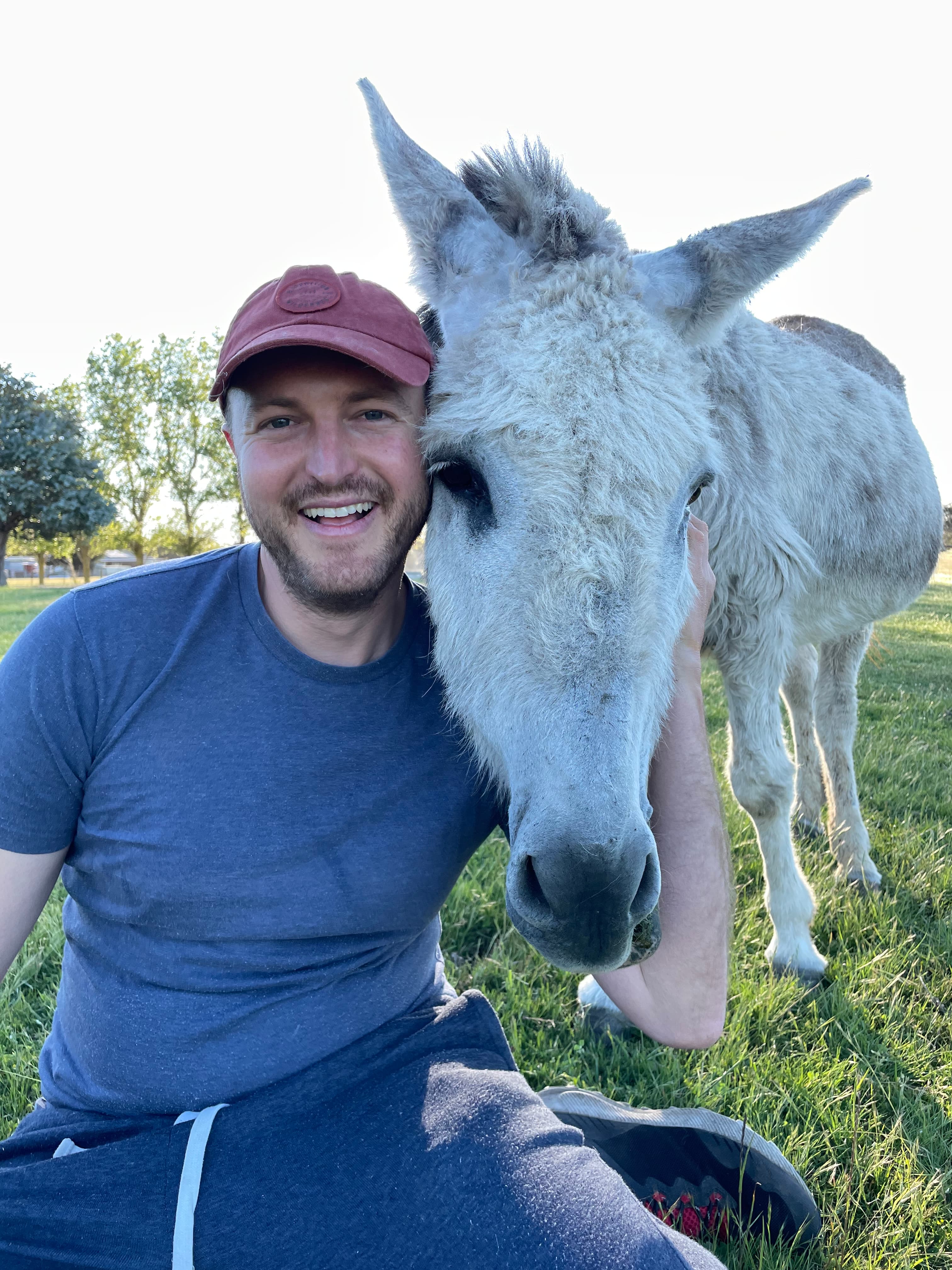 Kyle with donkey at the sanctuary